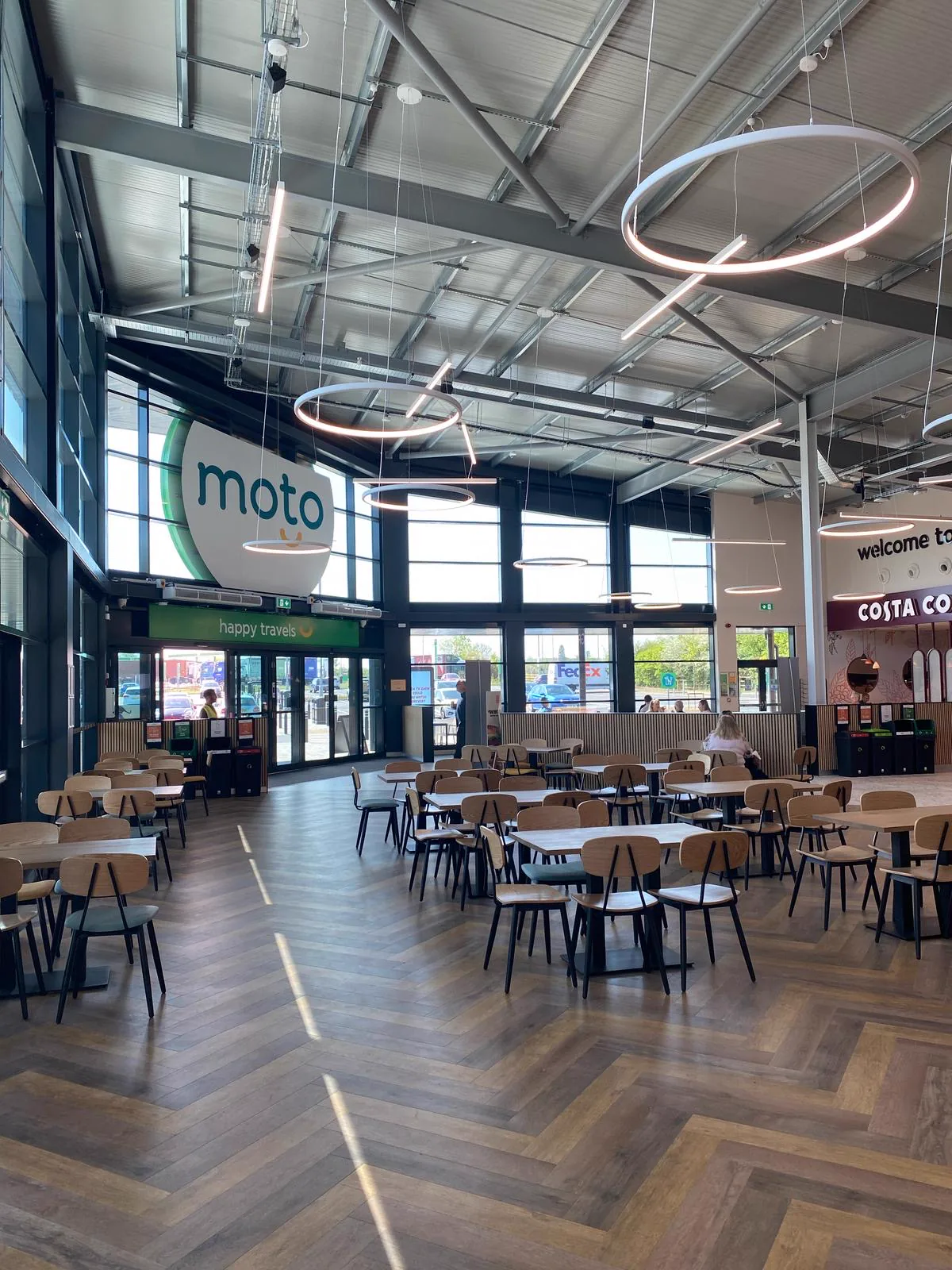 Interior view towards a glazed commercial entrance at Sawtry services