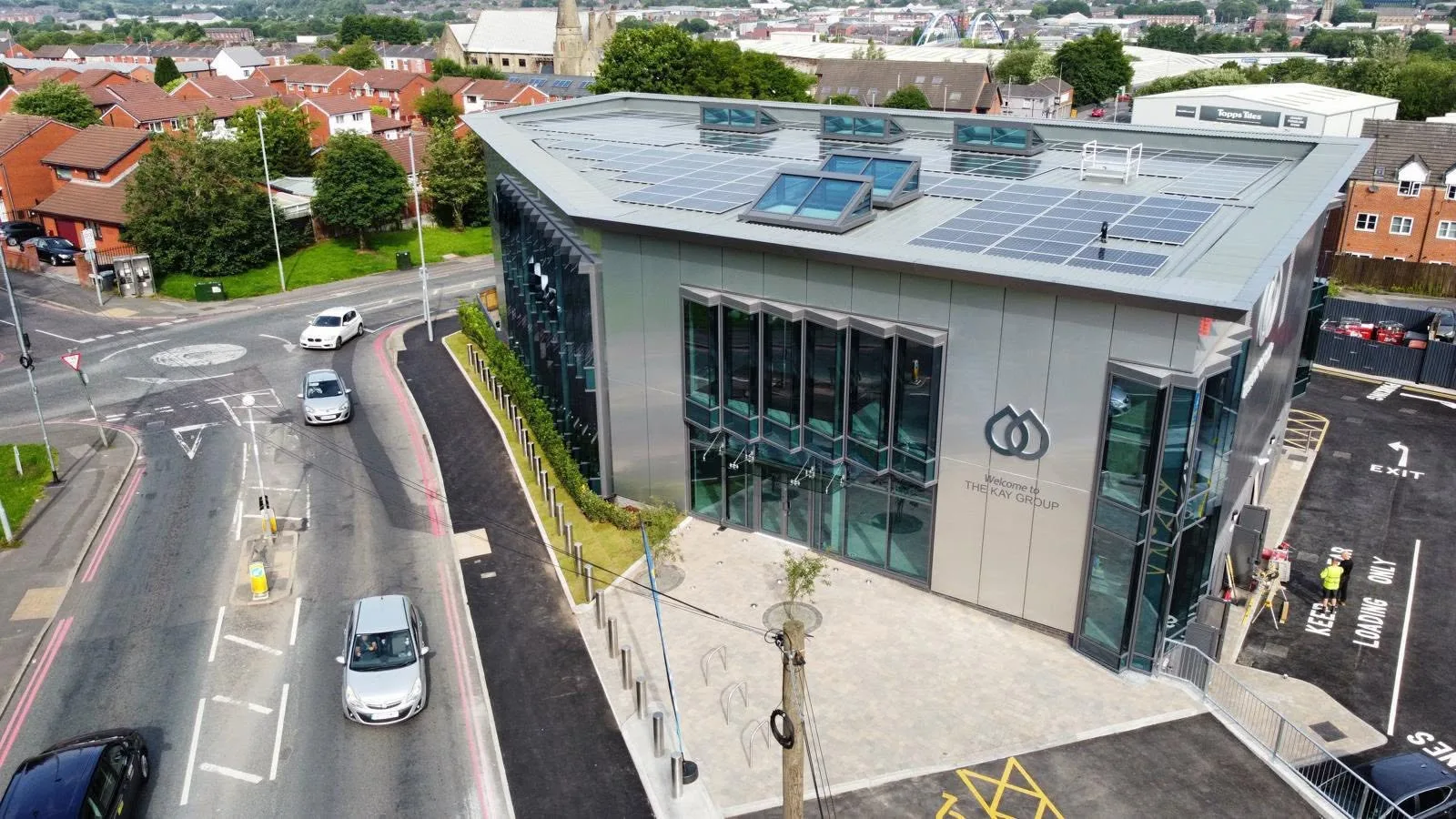 Aerial view of The Kay Group commercial building and its completed glazed façades