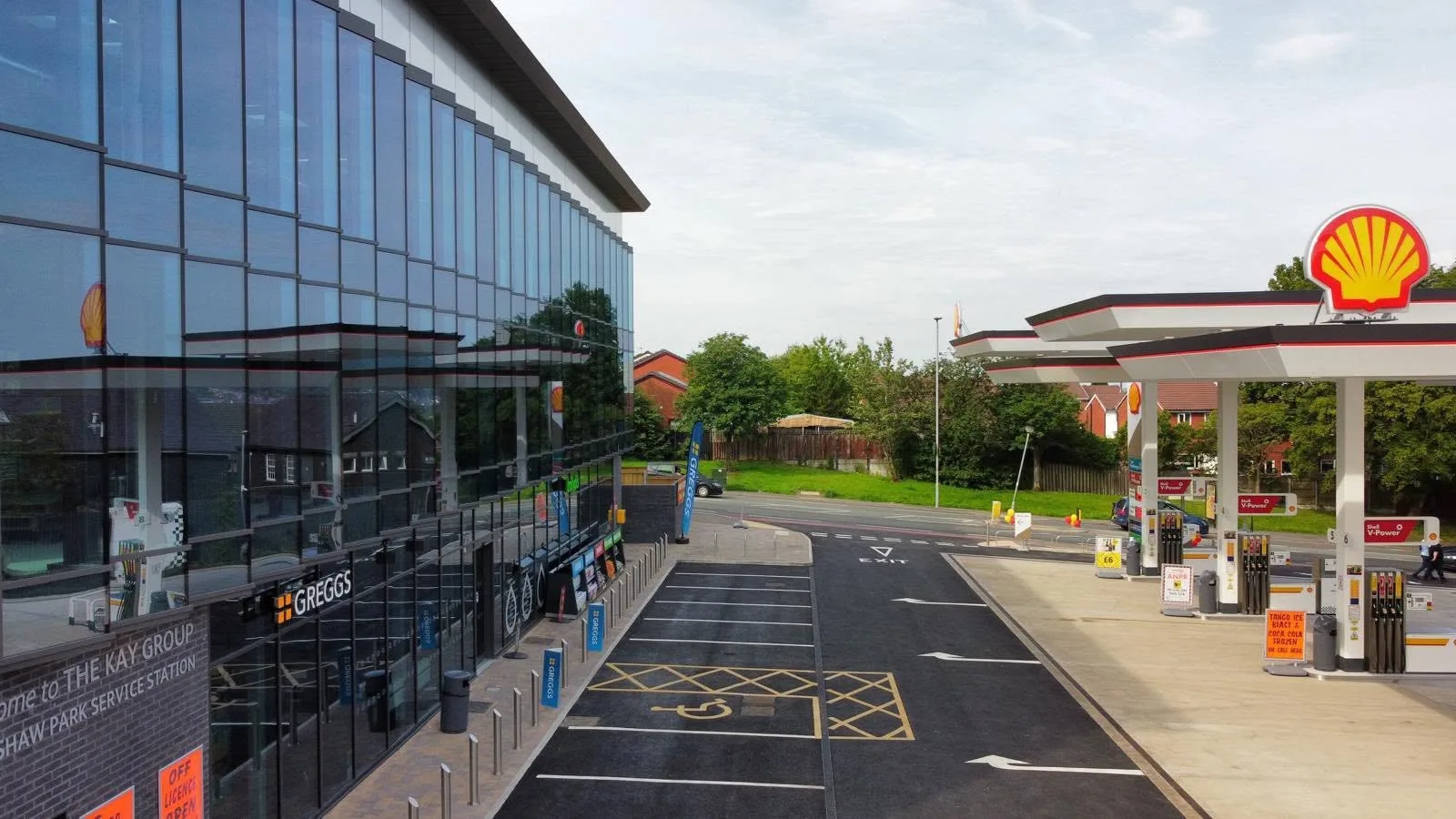 Completed glazed commercial frontage beside the Kirkshaw Park service-station forecourt